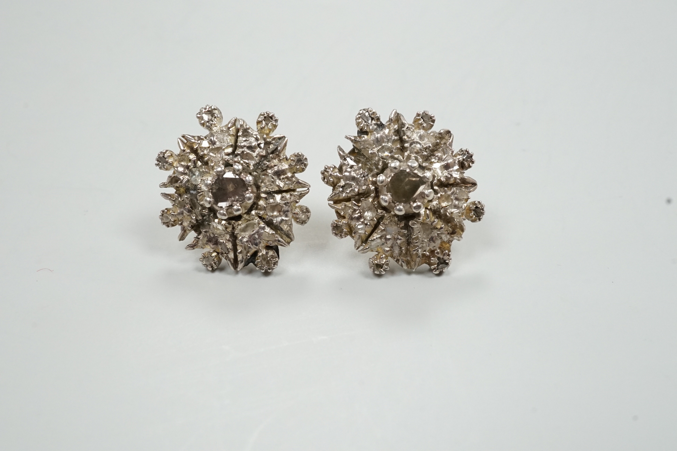 A pair of yellow and white metal, rose cut diamond cluster set earrings (lacking butterflies), diameter 21mm, gross weight 13.4 grams (adapted?).